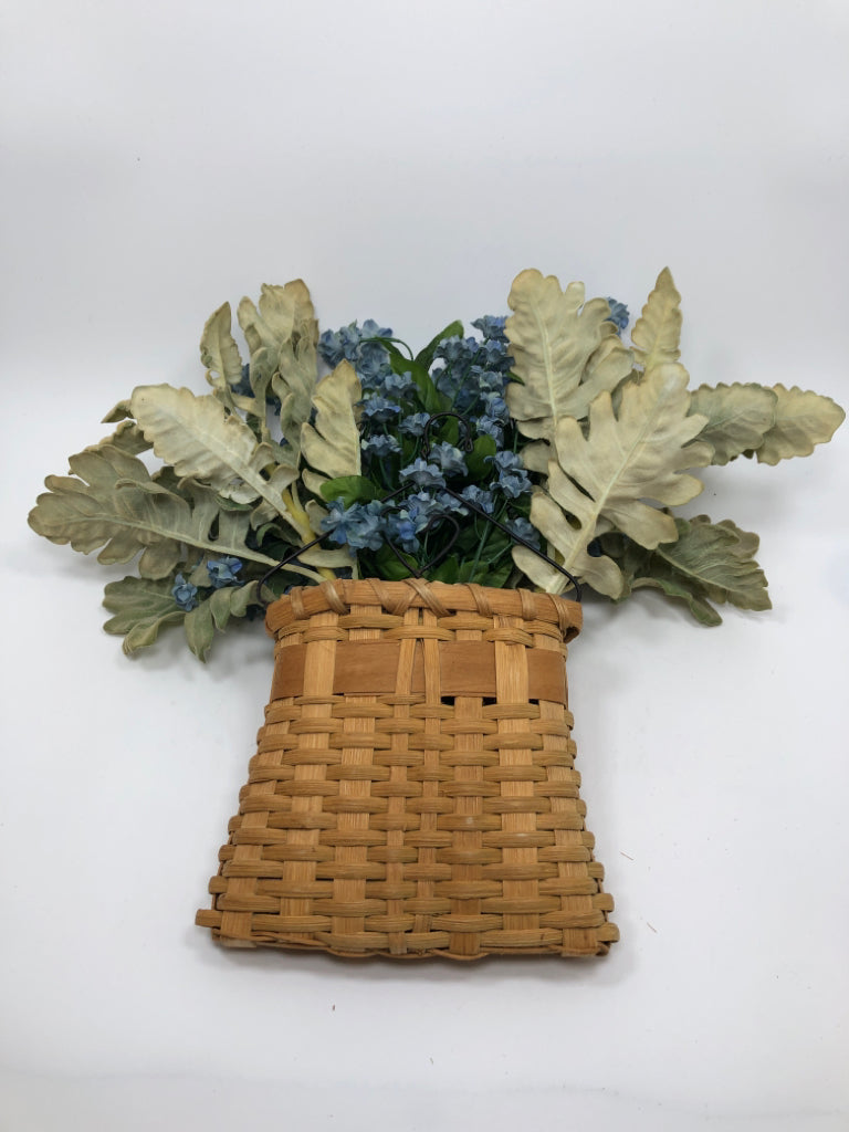 FAUX BLUE FLORALS IN WOVEN BASKET WALL POCKET.