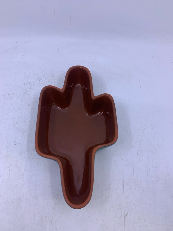 GREEN W/ BROWN INSIDE CACTUS SHAPED BOWL.