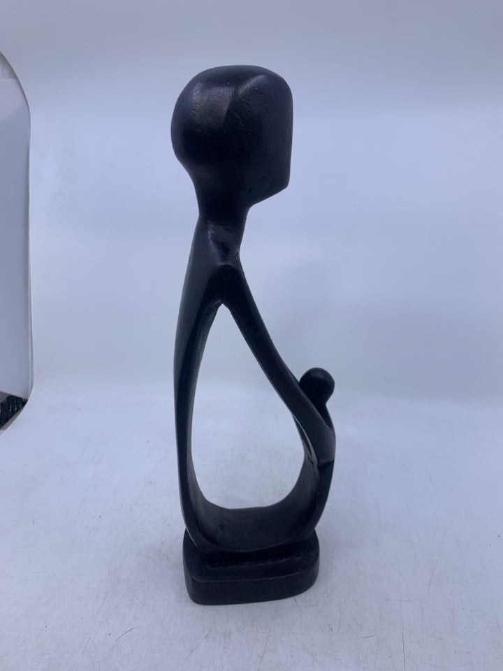 BLACK CARVED WOOD FOLK ART MAN & CHILD.