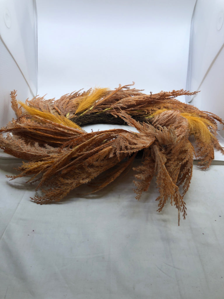 ORANGE FEATHER STYLE TWIG WREATH.