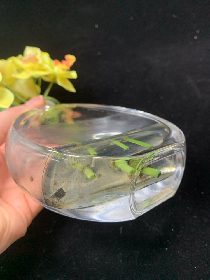 YELLOW FLORALS IN CLEAR FLAT VASE.