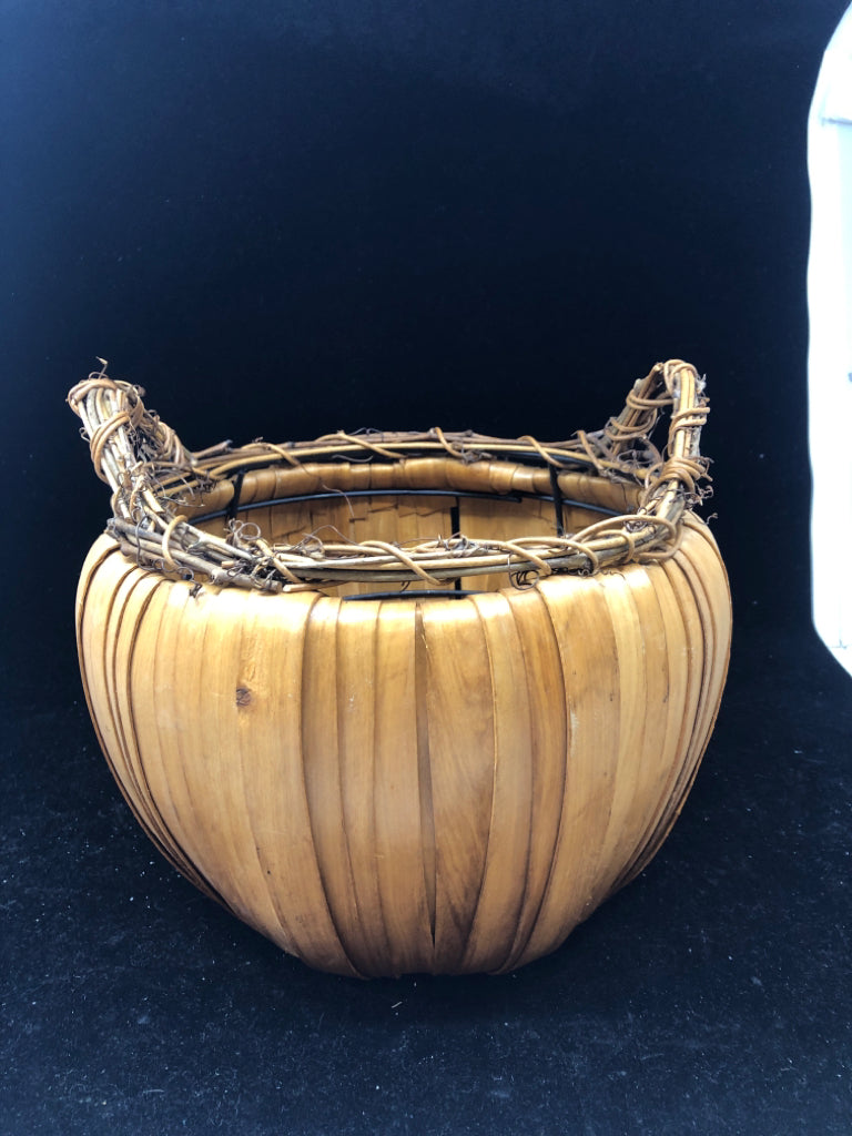 WELL MADE ROUND BASKET W TWIG WRAPPED HANDLES.