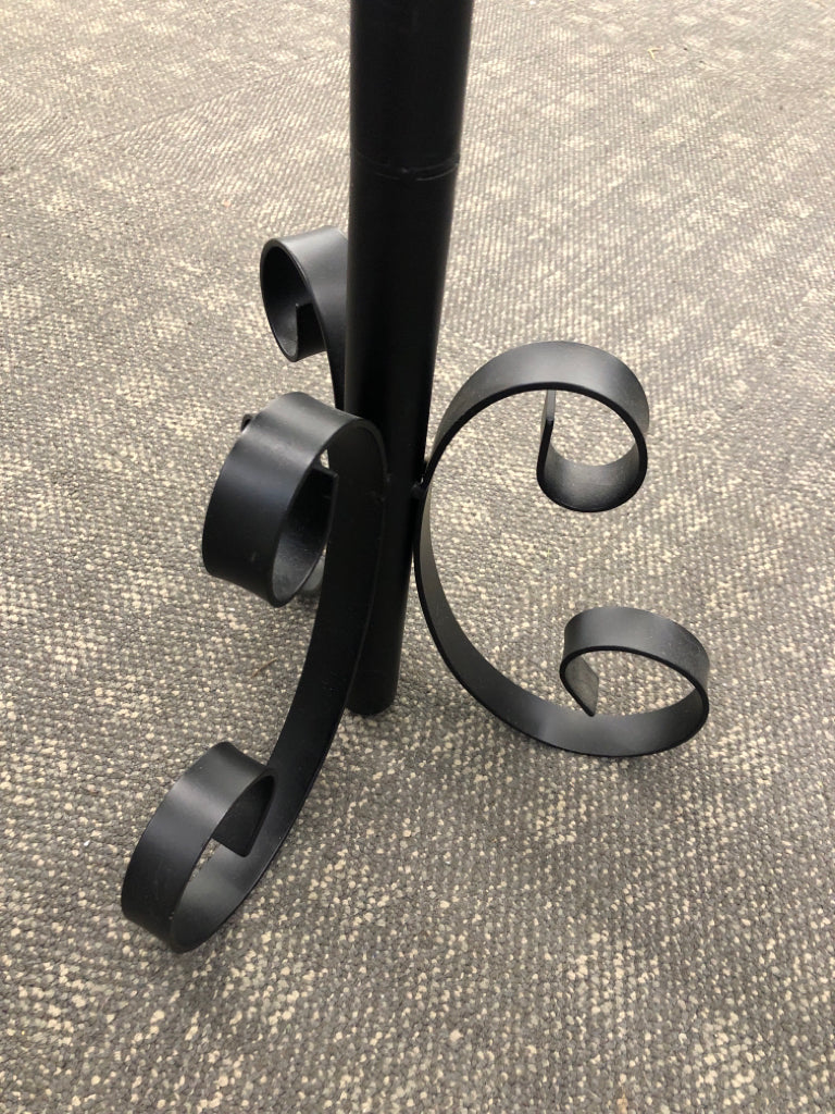 BLACK METAL SCROLL BASE CANDLE LANTERN.