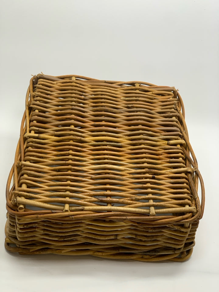 SLANTED BROWN WICKER BASKET.