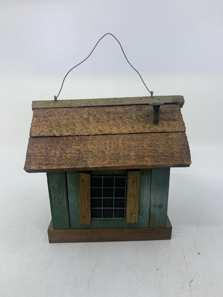 DISTRESSED GREEN CABIN W/ WINDOWS.