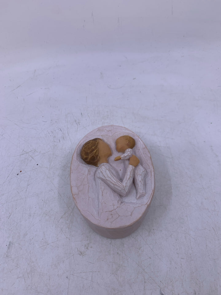 SMALL OVAL GRANDMOTHER HOLDING BABY.