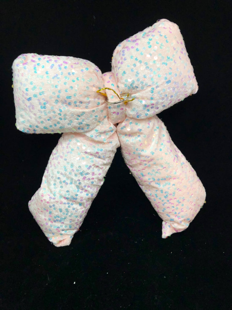 PINK PLUSH BOW W/ IRIDESCENT SEQUINS.