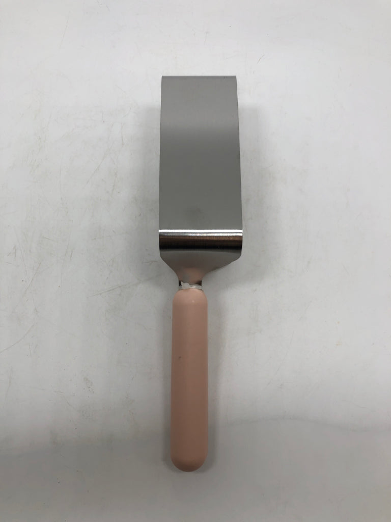 NIP PINK HANDLE CAKE SLICER.