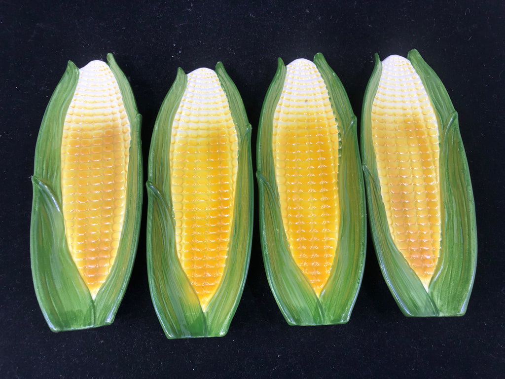 4 CORN TRAYS.