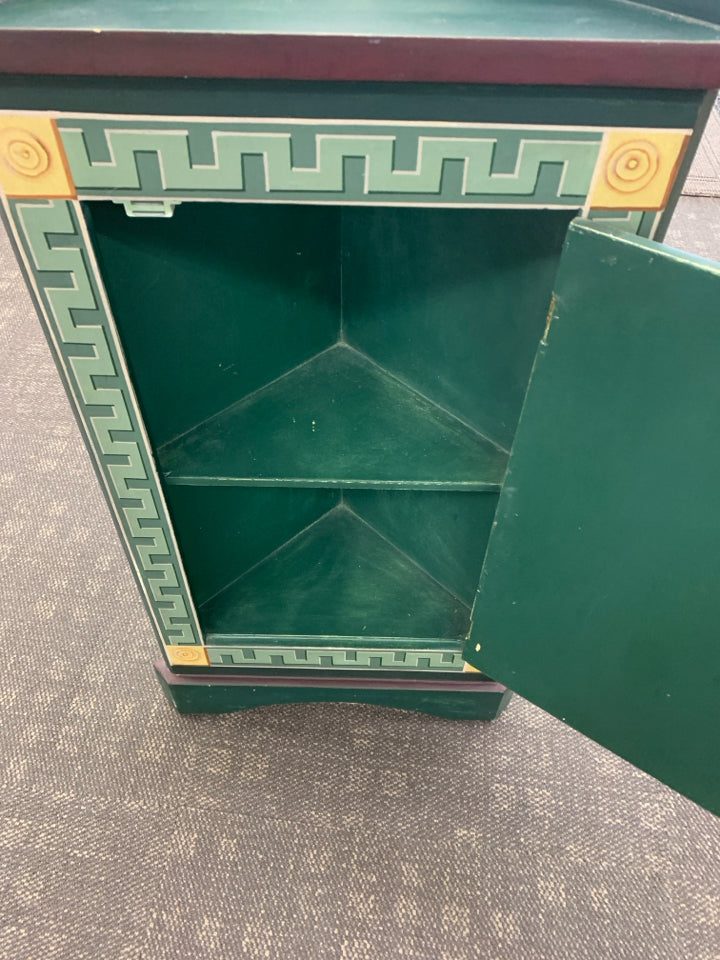 SMALL CORNER CABINET DARK GREEN/MAROON W/ VASE YELLOW ROSES.