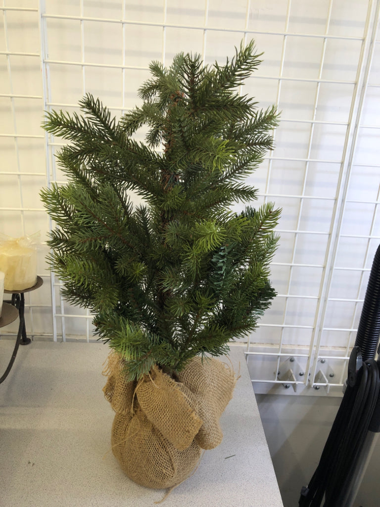 FAUX PINE TREE IN BURLAP PLANTER.