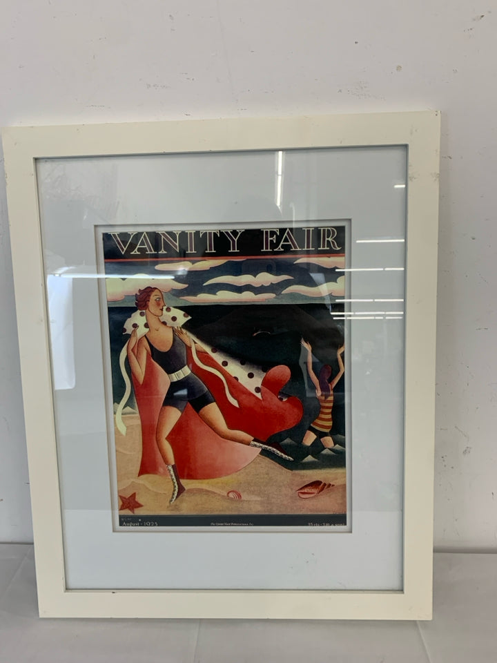 VANITY FAIR OCEAN GUY W CAPE WALL ART IN WHITE FRAME.