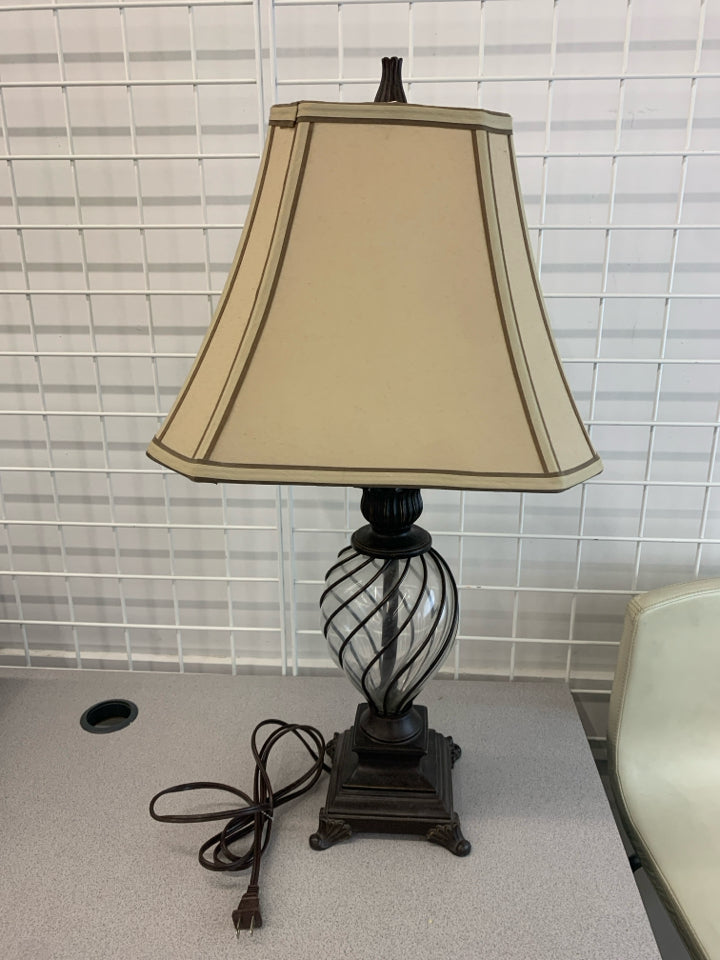 GLASS BALL AND GREY METAL BASE LAMP W/TAN SHADE.
