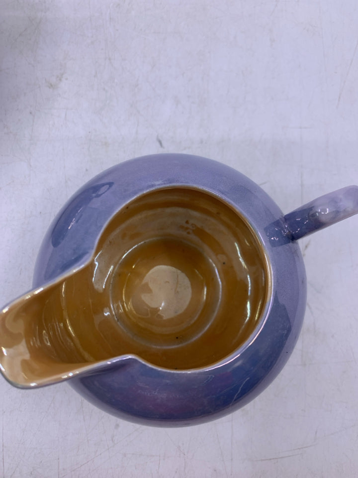 BLUE IRIDESCENT W/ ORANGE INSIDE.