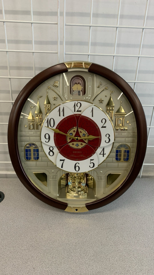 MELODIES IN MOTION SWAROVSKI WALL CLOCK.