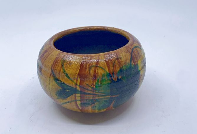 BROWN POTTERY PAINTED PLANTER.