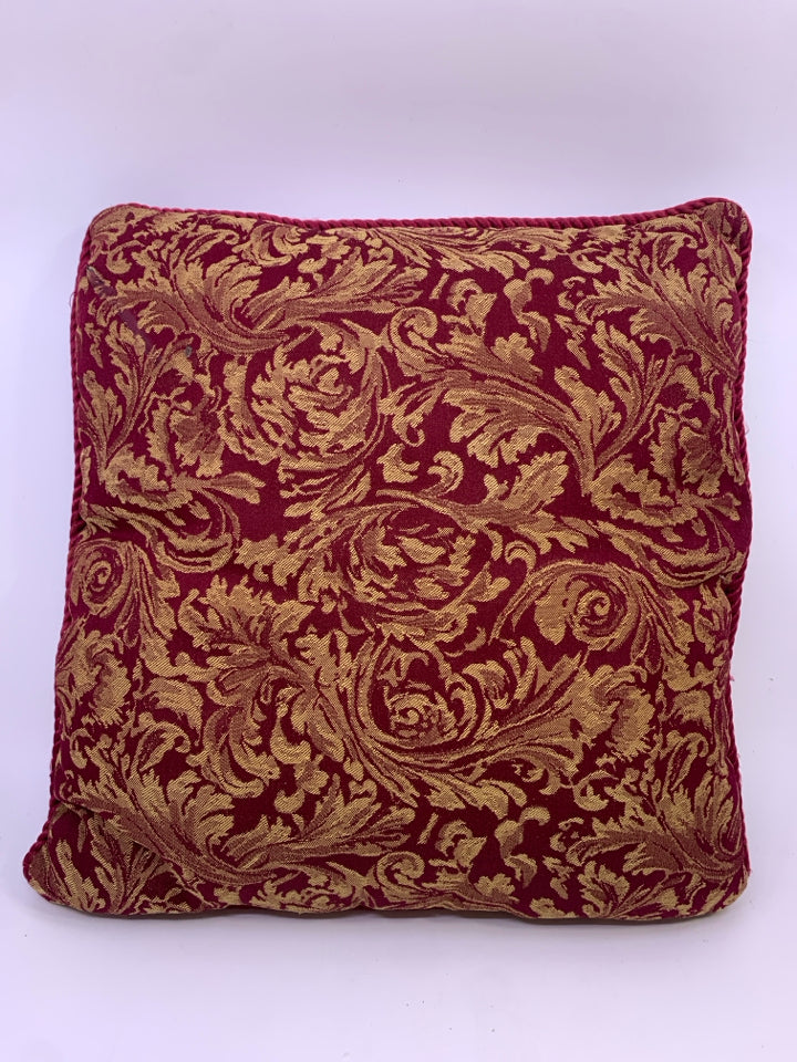 RED W/GOLD FLORAL ACCENT PILLOW.