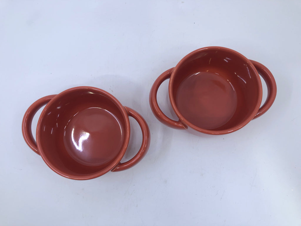2 ORANGE BAKERS W HANDLES.