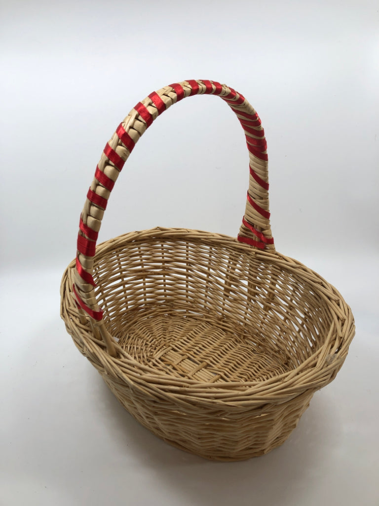WICKER BASKET W/RED WRAP HANDLE.