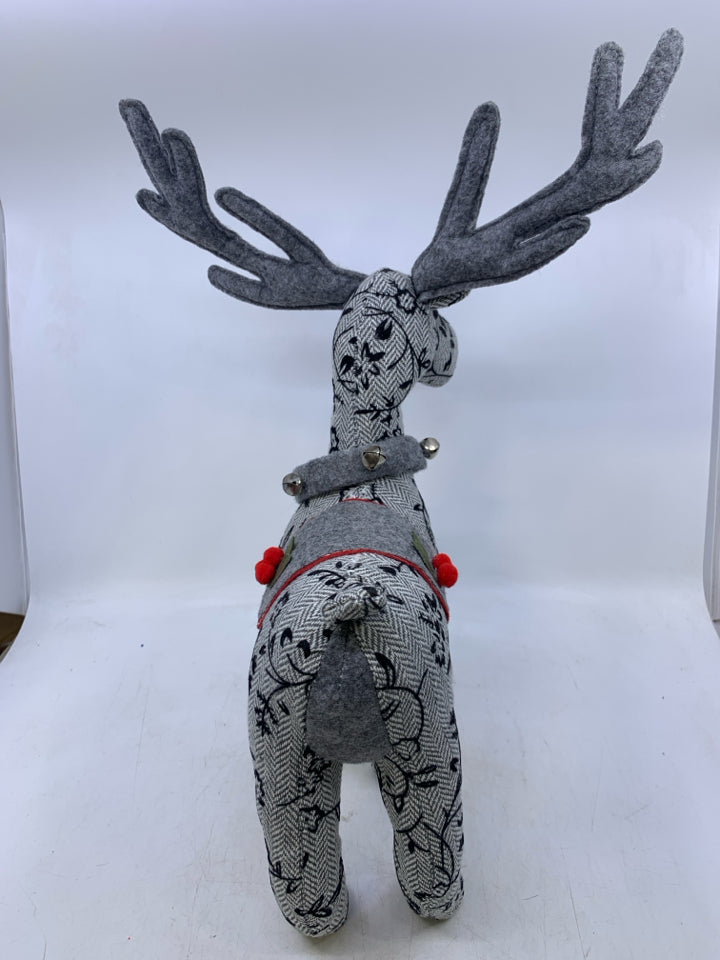 GREY W/ EMBROIDERED BLACK FLOWERS STANDING REINDEER PLUSH.