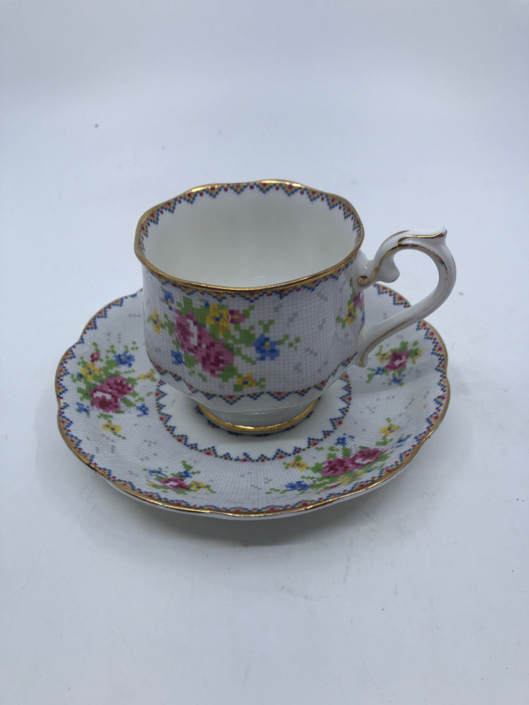 VTG PETIT POINT PATTERN W PINK ROSES TEACUP AND SAUCER.