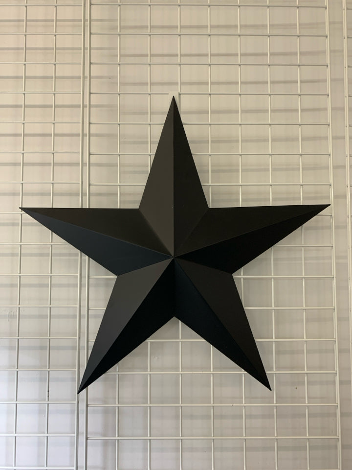 LARGE BLACK METAL 3D STAR WALL ART.