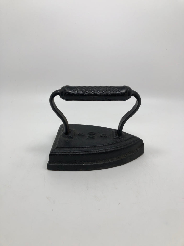 VTG SAD IRON METAL DOOR STOPPER.