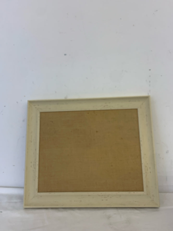 CREAM FRAMED CORK BOARD.