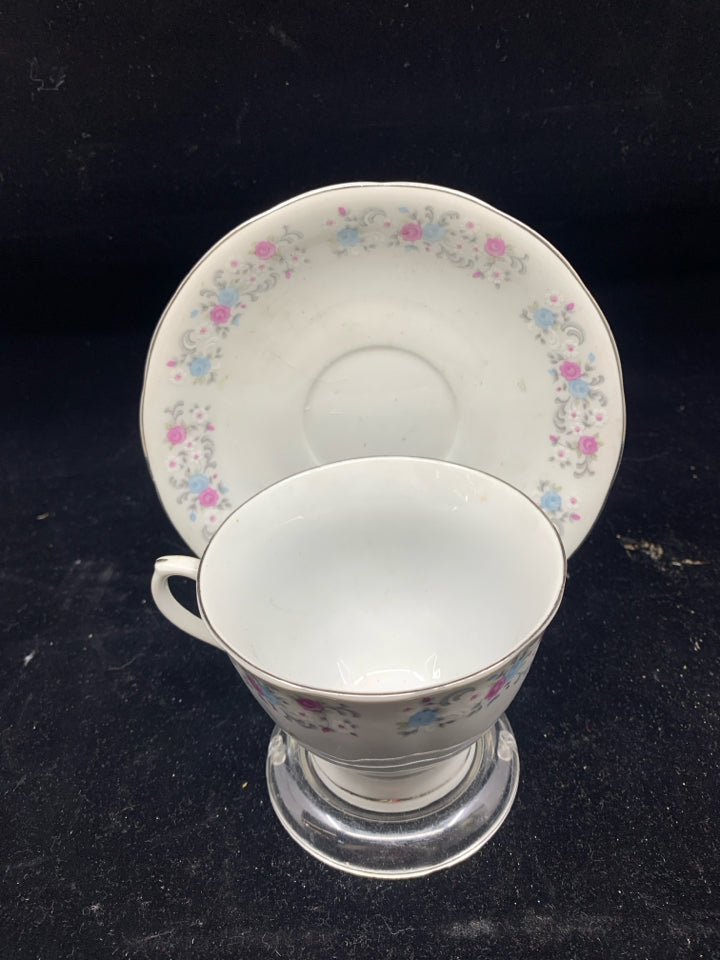 PINK AND BLUE FLORAL TEA CUP AND SAUCER.