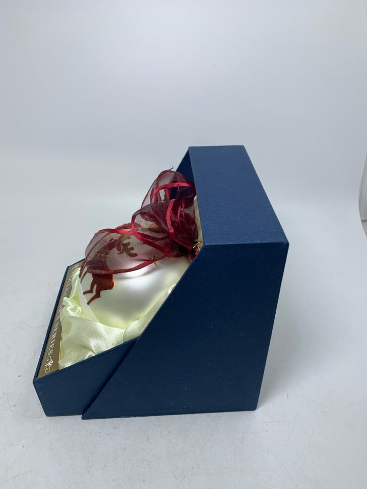 LARGE WHITE ORNAMENT W/ SANTA WALKING REINDEER IN BOX.