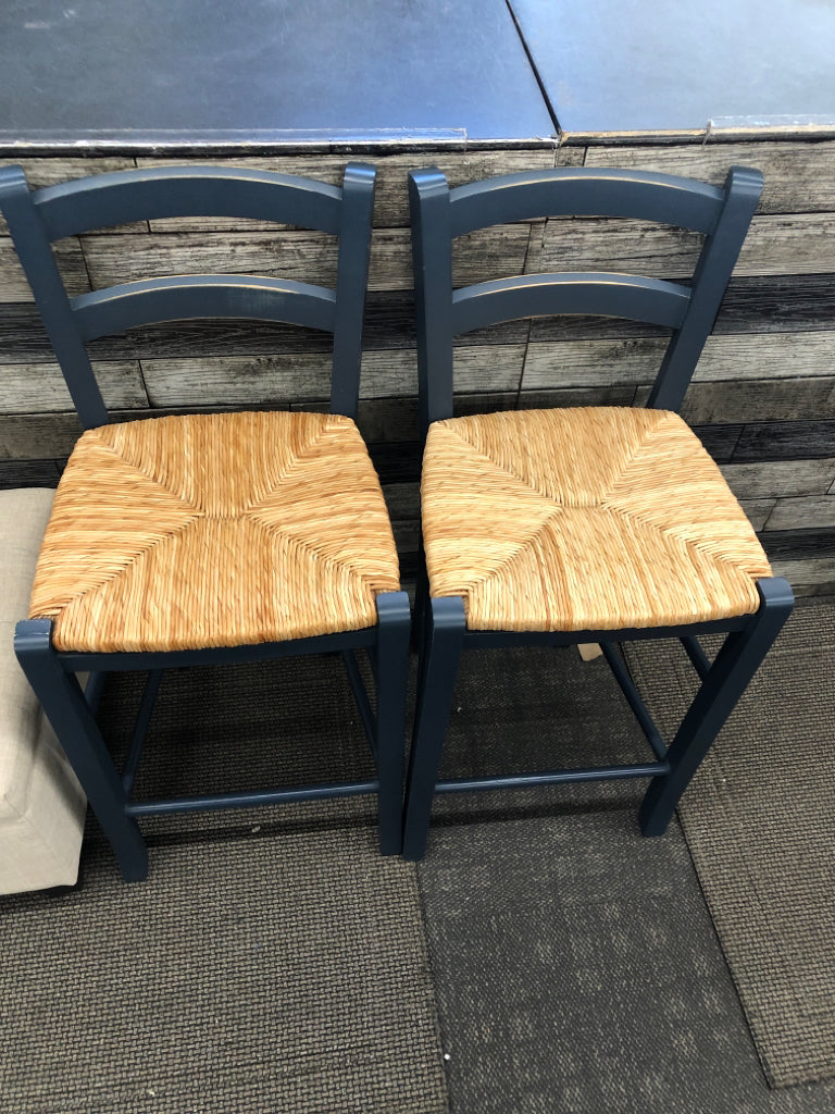 2 BLUE WOOD BAR STOOLS W/ WICKER SEAT.