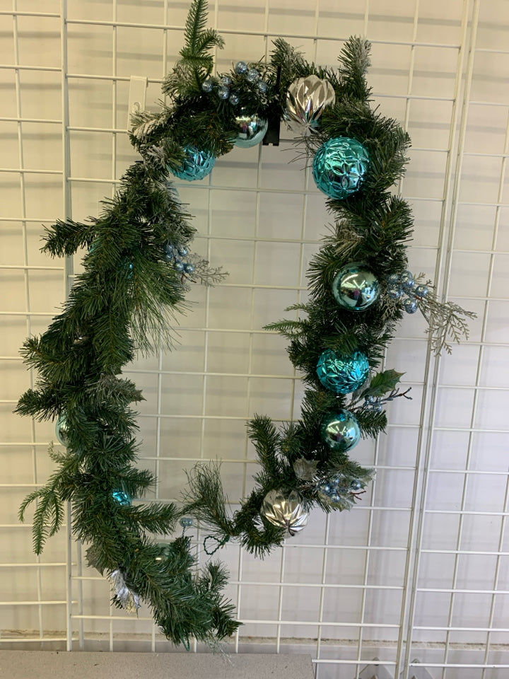 FROSTED GARLAND W BLUE AND SILVER BULBS.