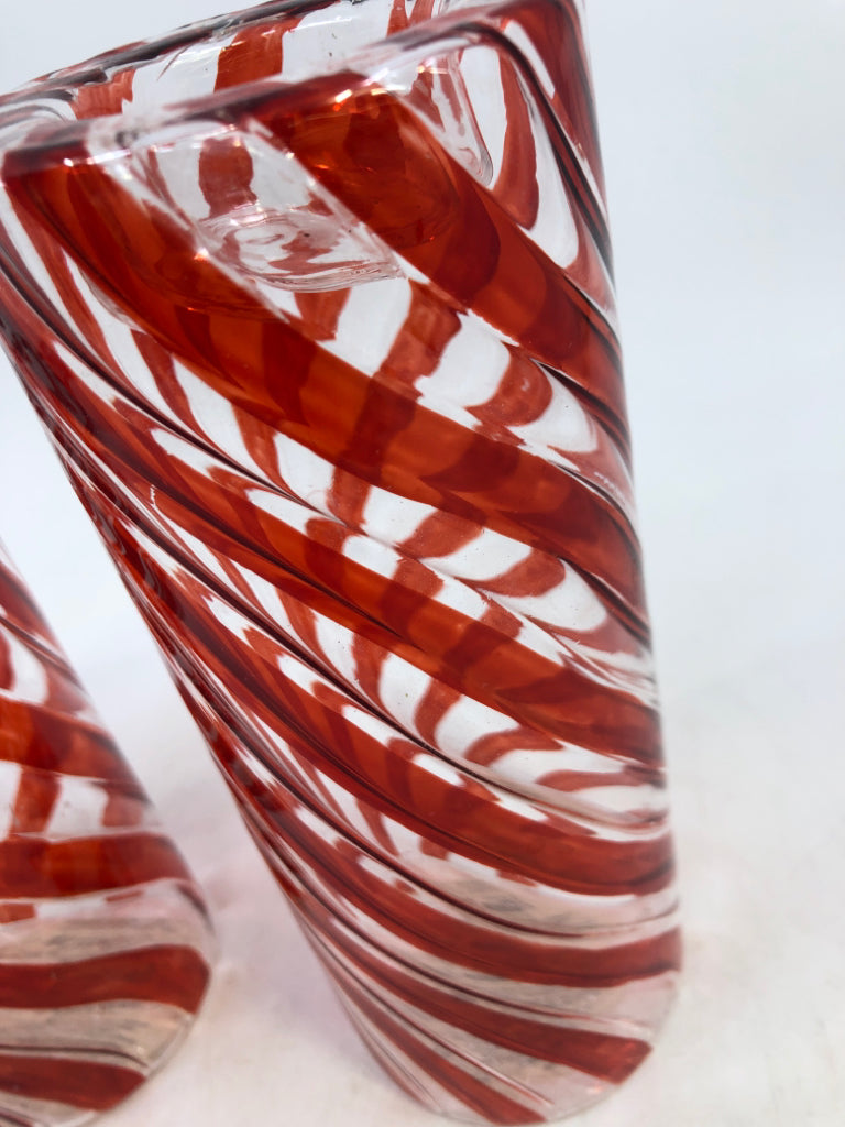 2 GLASS RED SWIRL CANDLE HOLDERS.