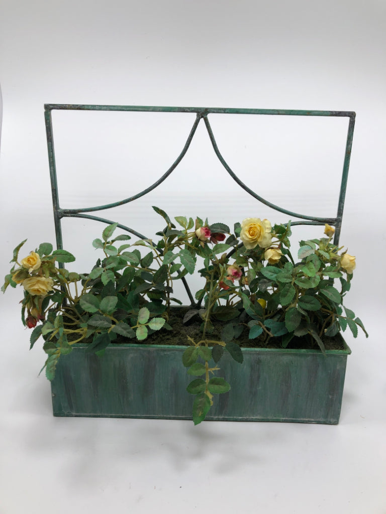 FAUX ROSES IN GREEN METAL PLANTER BOX.