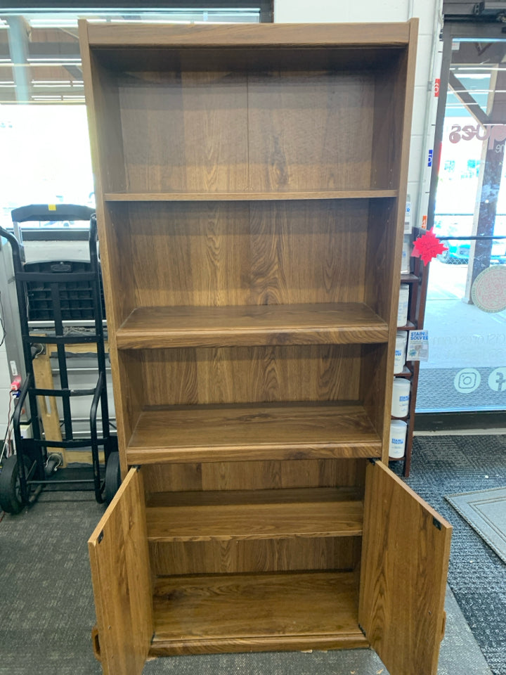 DARK FAUX WOOD BOOKCASE W/ BOTTOM CABINET.