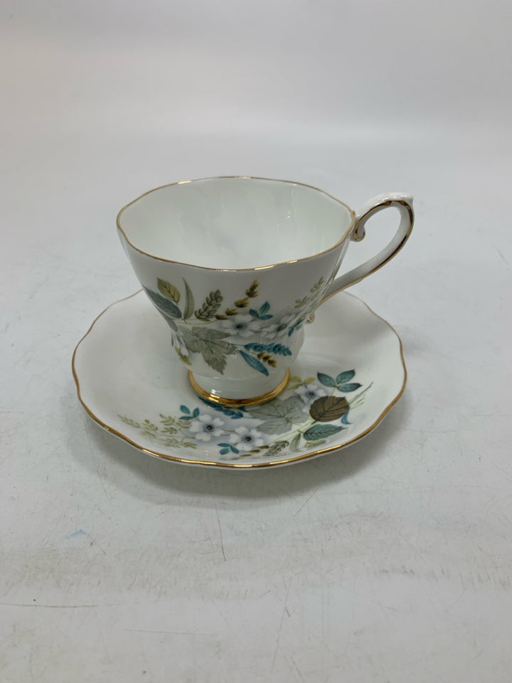 COLORFUL LEAVES W/ WHITE FLOWERS TEA CUP.