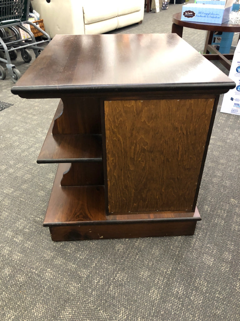 DARK WOOD SIDE TABLE WITH DRAWER/DOOR AND SHELVES.