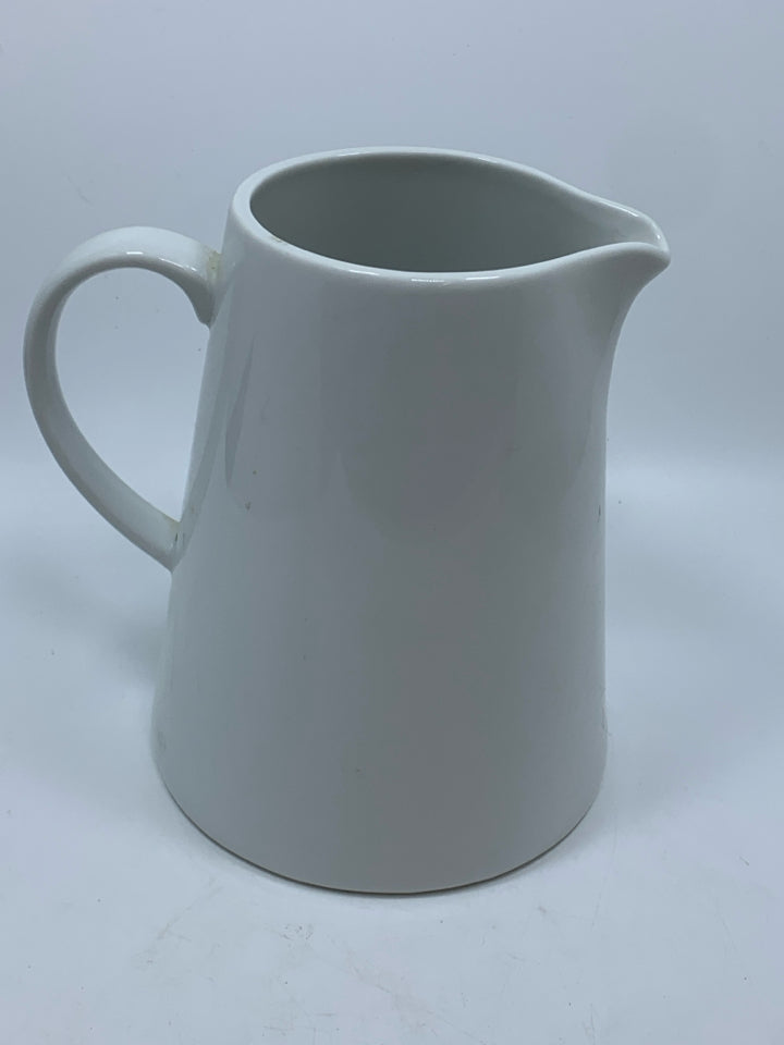 WHITE CERAMIC PITCHER.