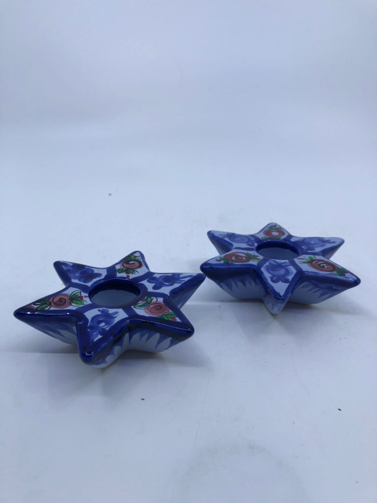 2 BLUE STAR CANDLE HOLDERS.