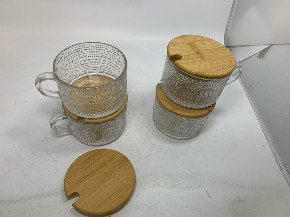 4 TEXTURED MUGS W/ WOOD LIDS.