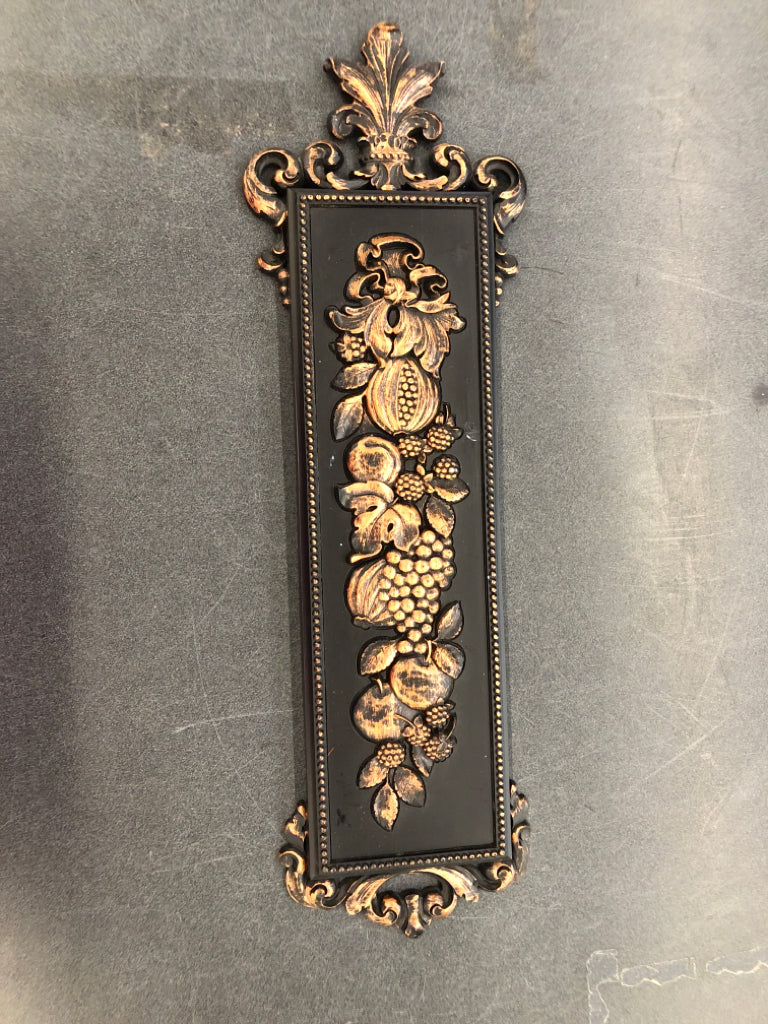 FRUIT EMBOSSED BLACK W BRONZE ACCENTS WALL HANGING.