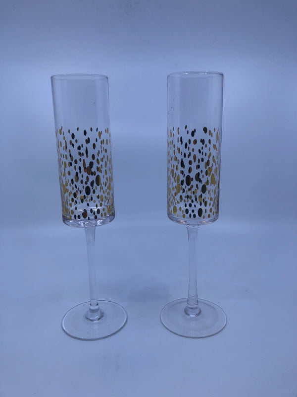 2 CHAMPAGNE FLUTES W/ GOLDEN CIRCLES MOVING UP GLASS.