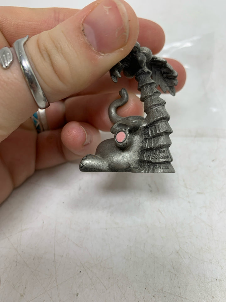 ELEPHANT UNDER PALM TREE FIGURINE.