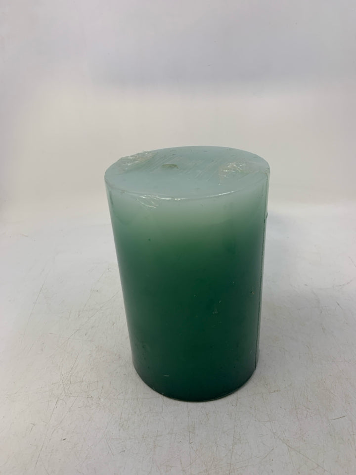 LARGE GREEN/TEAL PILLAR CANDLE.