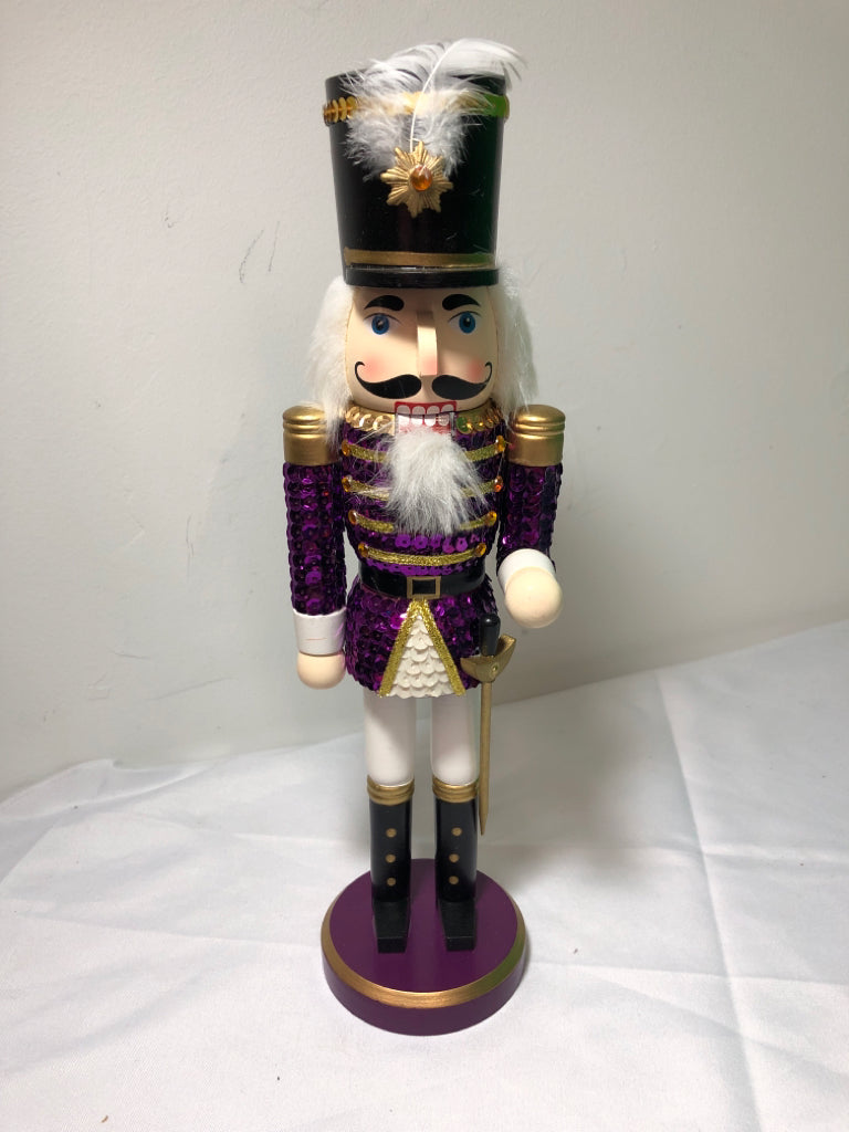 PURPLE SEQUIN NUT CRACKER.