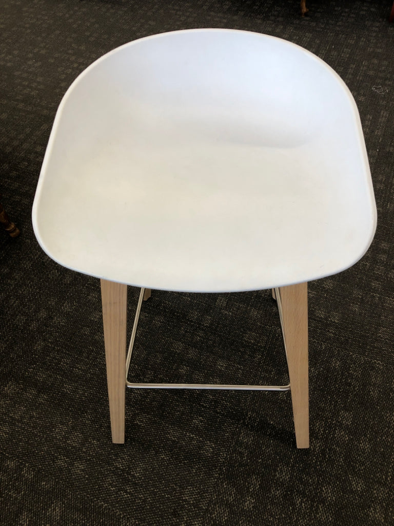 WHITE STOOL CONTEMPORARY W/BLOND WOOD LEGS & WIRE REINFORCED.