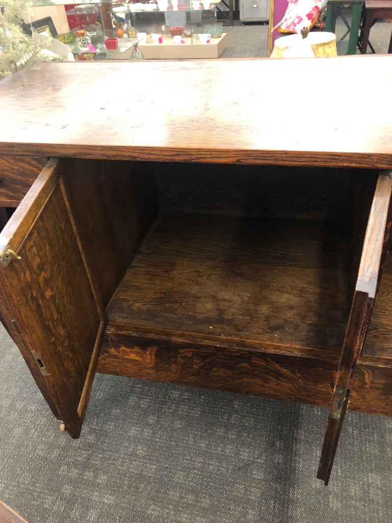 VTG LARGE BUFFET TABLE W 3 DRAWERS AND CABINET ON WHEELS.