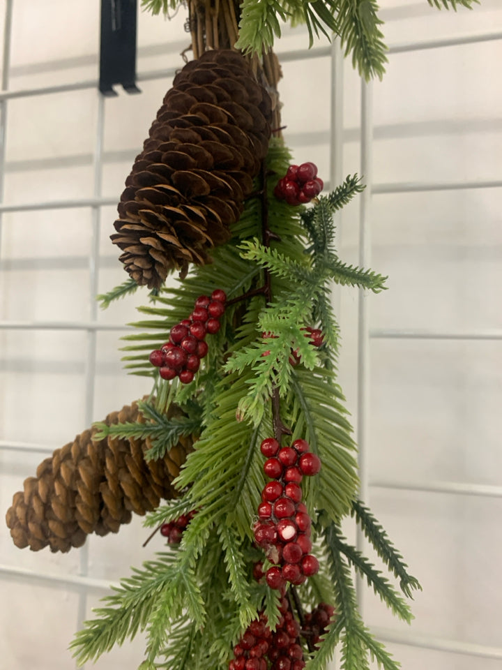 PINECONES AND RED PIP BERRY GARLAND.