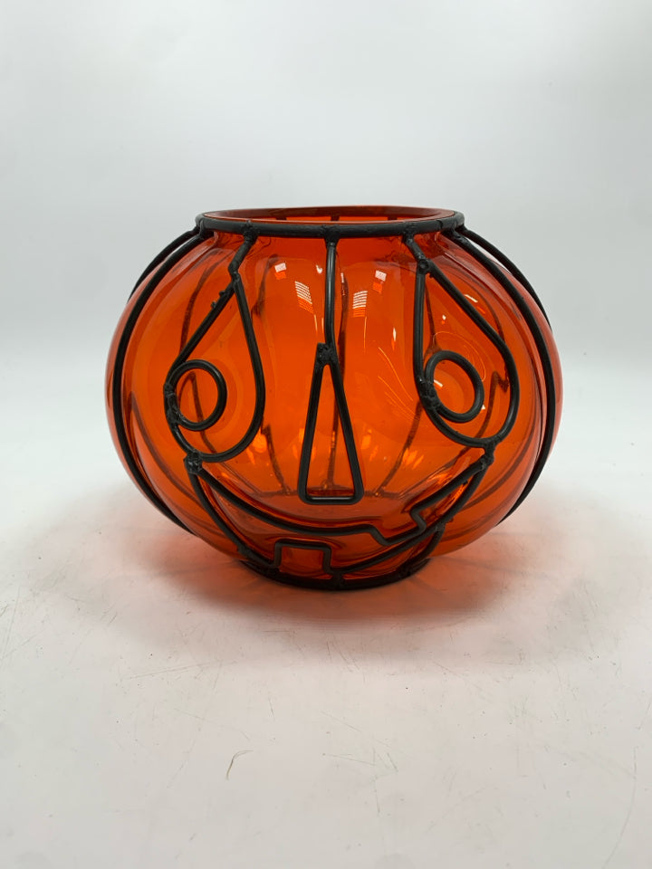 ORANGE GLASS IN BLACK PUMPKIN FACE CANDLE HOLDER.