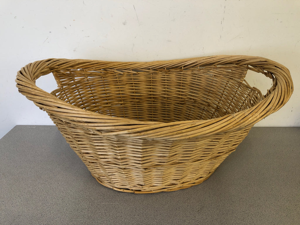 LARGE OVAL BLONDE BASKET W HANDLES.